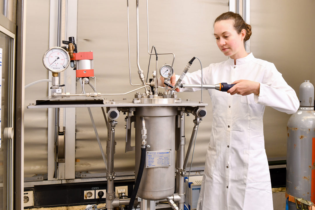 A scientist works on a test rig